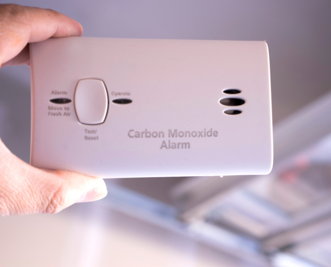 Woman disposing of spoiled food from the fridge.