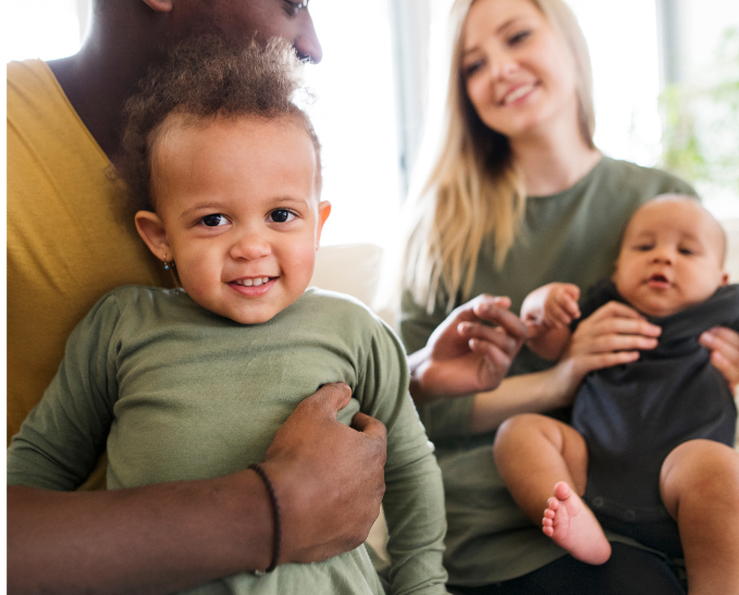 A flooded street with a fire truck parked on the side of the road.